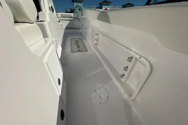 Slide: The Image of Interior view of 2026 Twin Vee 340 GFX CC boat, showcasing sleek white design. - 17
