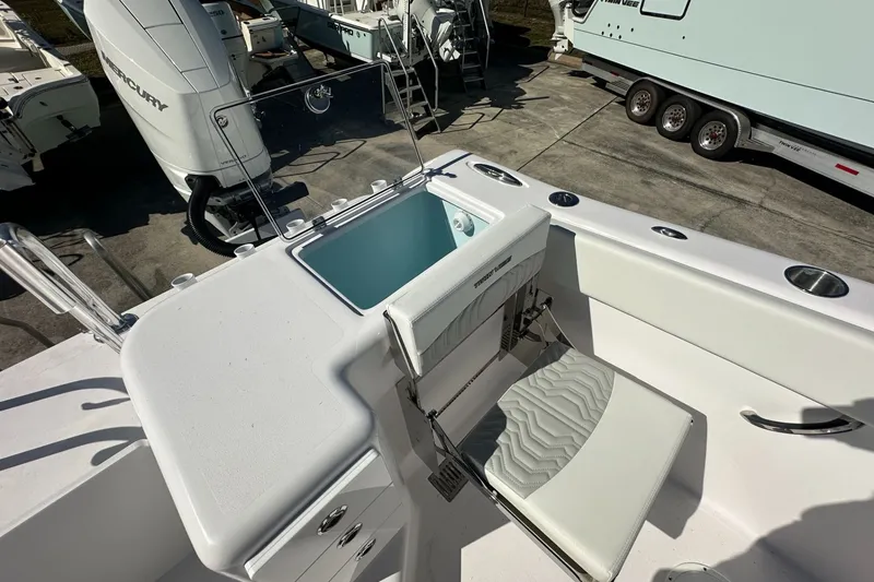 Slide: The Image of 2026 Twin Vee 340 GFX CC boat interior with seating and storage compartments. - 16