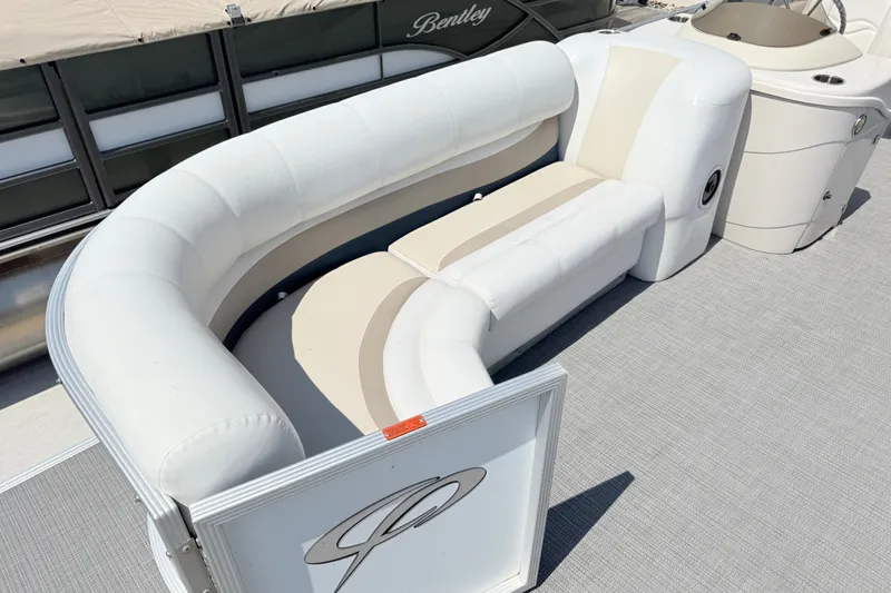 Slide: The Image of 2009 Crest 20 Caribbean boat with white cushioned seating on deck. - 13