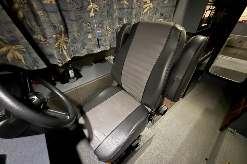 Slide: The Image of Interior of 2012 Wooldridge 29 Super Sport Pilothouse with leather seating and steering wheel. - 16