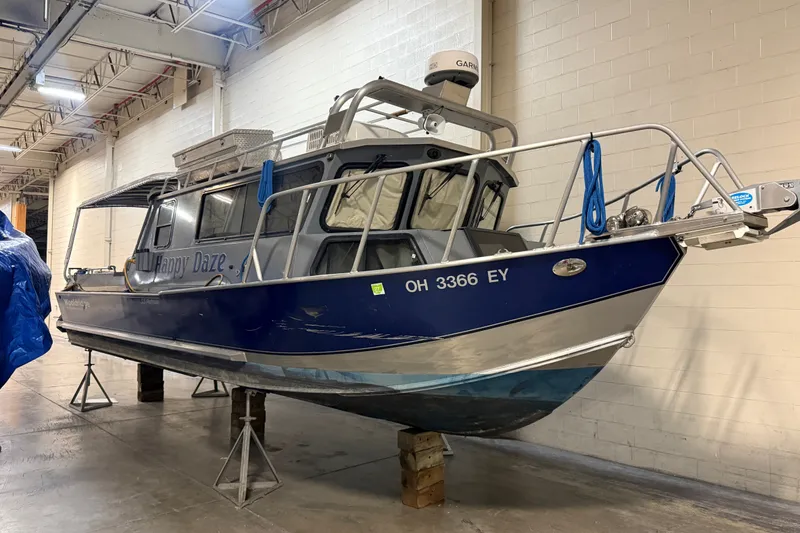 The Image of 2012 Wooldridge 29 Super Sport Pilothouse boat in indoor storage. - 0