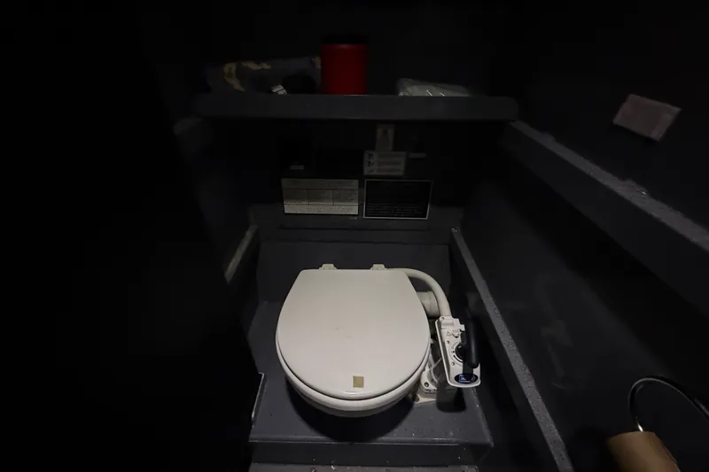 Slide: The Image of Interior of 2012 Wooldridge 29 Super Sport Pilothouse boat bathroom with toilet. - 20