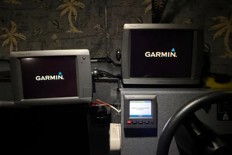 Slide: The Image of Garmin navigation displays in 2012 Wooldridge 29 Super Sport Pilothouse boat cockpit. - 31