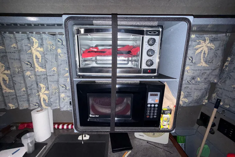 Slide: The Image of Interior of 2012 Wooldridge 29 Super Sport Pilothouse with microwave and toaster oven. - 10