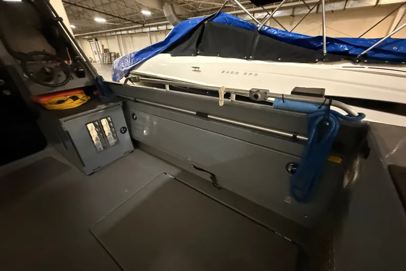Slide: The Image of Interior view of 2012 Wooldridge 29 Super Sport Pilothouse boat in storage. - 6