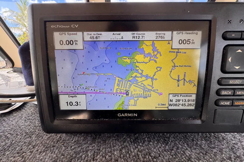 Slide: The Image of Garmin GPS display on 2005 Atlas Boat Works Acadia 25, showing navigation map and coordinates. - 24