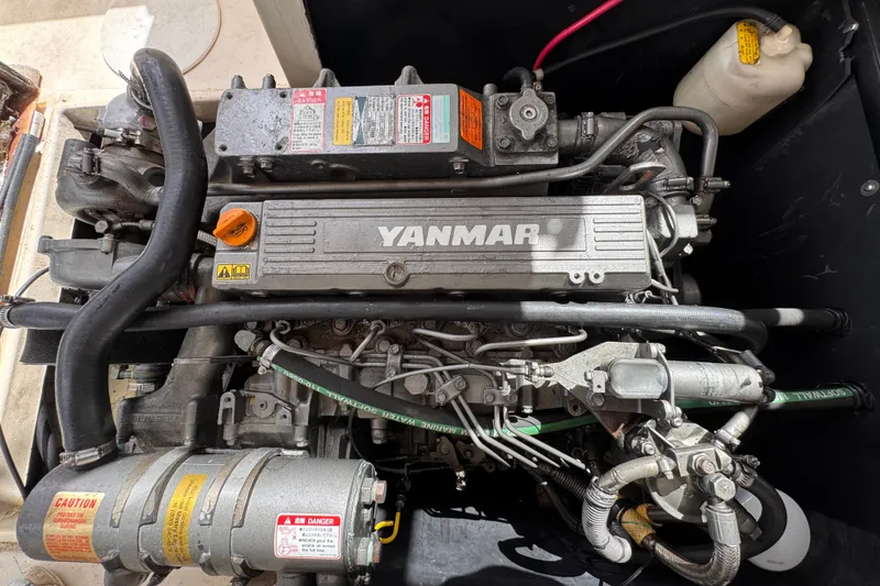 Slide: The Image of Yanmar engine in a 2005 Atlas Boat Works Acadia 25, showcasing detailed components. - 49
