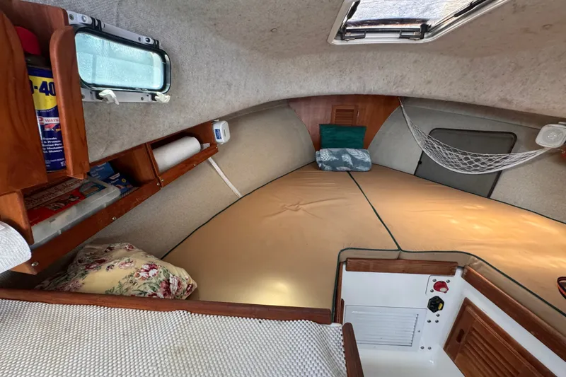 Slide: The Image of Cozy cabin interior of 2005 Atlas Boat Works Acadia 25 with storage and bedding. - 32