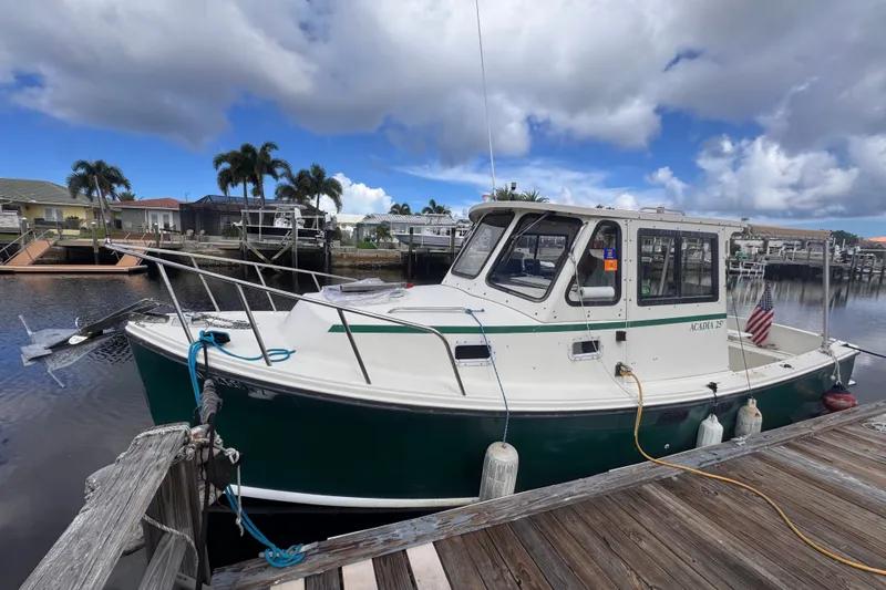 The Image of 2005 Atlas Boat Works Acadia 25 docked, featuring a classic design and serene waterfront setting. - 0