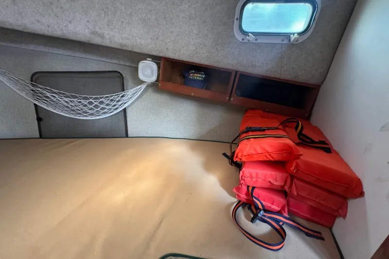 Slide: The Image of Interior cabin of 2005 Atlas Boat Works Acadia 25 with life jackets and storage. - 36