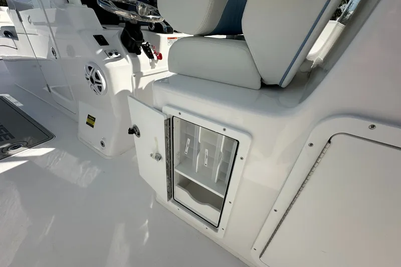 Slide: The Image of Interior view of 2026 Twin Vee 340 GFX CC boat, featuring storage compartment and seating. - 19