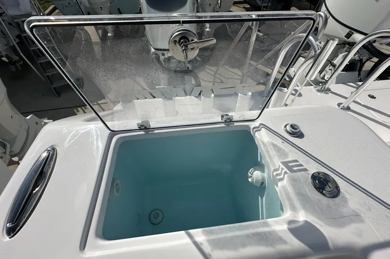 Slide: The Image of Livewell on 2026 Twin Vee 340 GFX CC boat, open lid, stainless steel handle. - 15