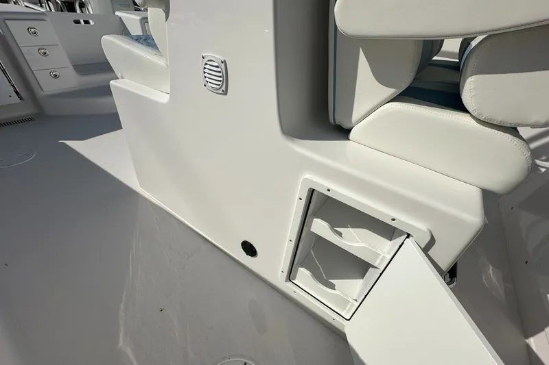 Slide: The Image of Interior view of 2026 Twin Vee 340 GFX CC boat, featuring seating and storage compartment. - 20