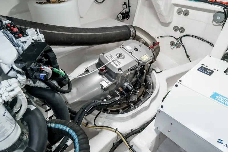 Slide: The Image of Engine room of 2027 Cruisers Yachts 50 Fly, showcasing advanced mechanical components. - 91