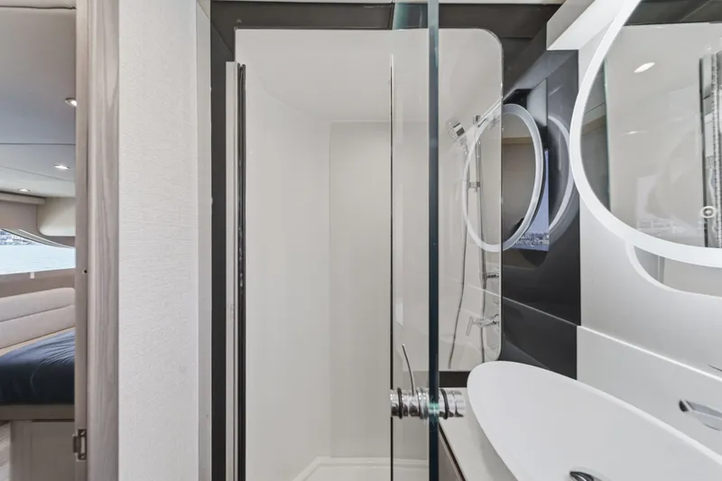 Slide: The Image of Luxurious bathroom interior of 2027 Cruisers Yachts 50 Fly with modern fixtures. - 80