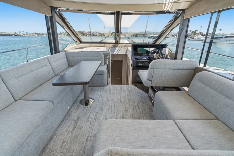 Slide: The Image of Luxurious interior of 2027 Cruisers Yachts 50 Fly with spacious seating and helm. - 60