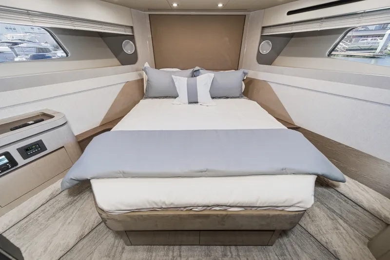 Slide: The Image of Luxurious bedroom interior of 2027 Cruisers Yachts 50 Fly with modern design and cozy bedding. - 82
