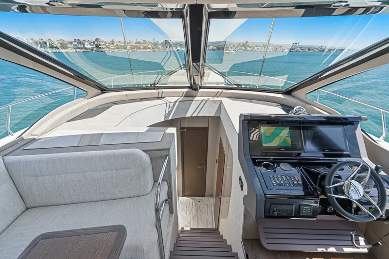 Slide: The Image of Luxurious 2027 Cruisers Yachts 50 Fly bridge interior with modern helm and panoramic views. - 72