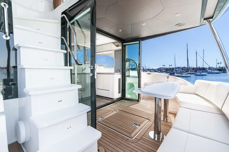 Slide: The Image of Luxurious 2027 Cruisers Yachts 50 Fly interior with elegant seating and marina view. - 46