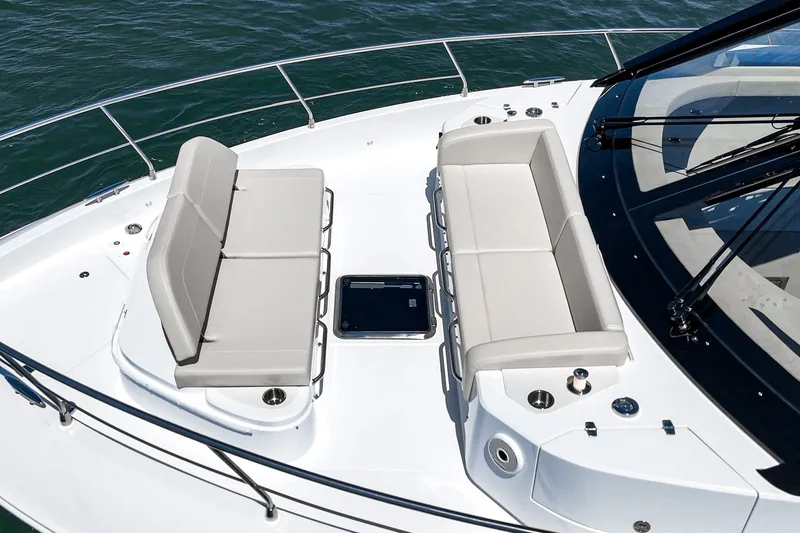 Slide: The Image of 2027 Cruisers Yachts 50 Fly deck with seating, overlooking the water. - 31