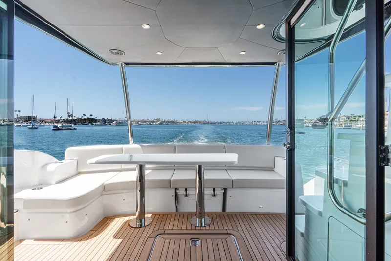 Slide: The Image of Luxurious 2027 Cruisers Yachts 50 Fly with spacious deck and scenic ocean view. - 49