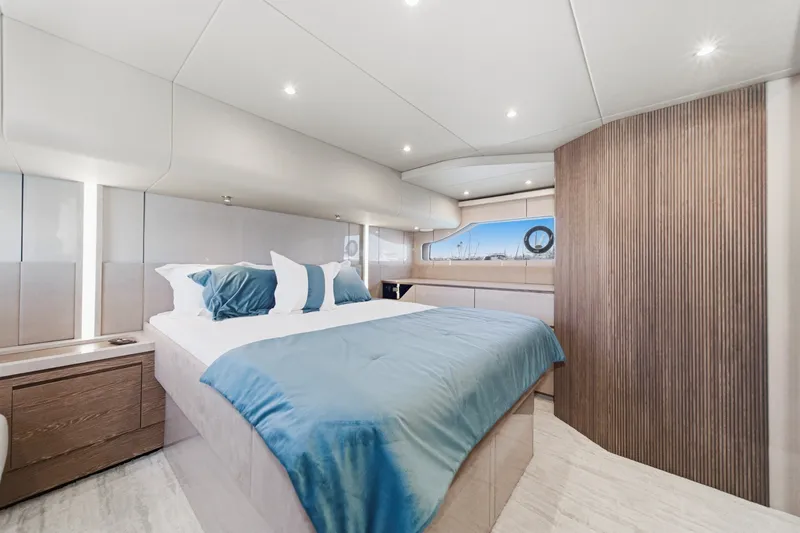 Slide: The Image of Luxurious bedroom interior of 2027 Cruisers Yachts 50 Fly with modern design and elegant decor. - 76