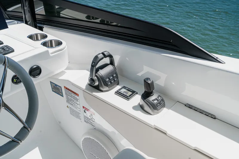 Slide: The Image of Helm controls of 2027 Cruisers Yachts 50 Fly, featuring modern navigation equipment. - 39