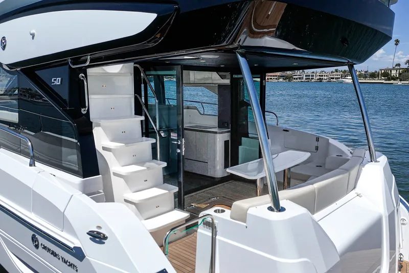 Slide: The Image of 2027 Cruisers Yachts 50 Fly luxury yacht with modern design and spacious deck area. - 45
