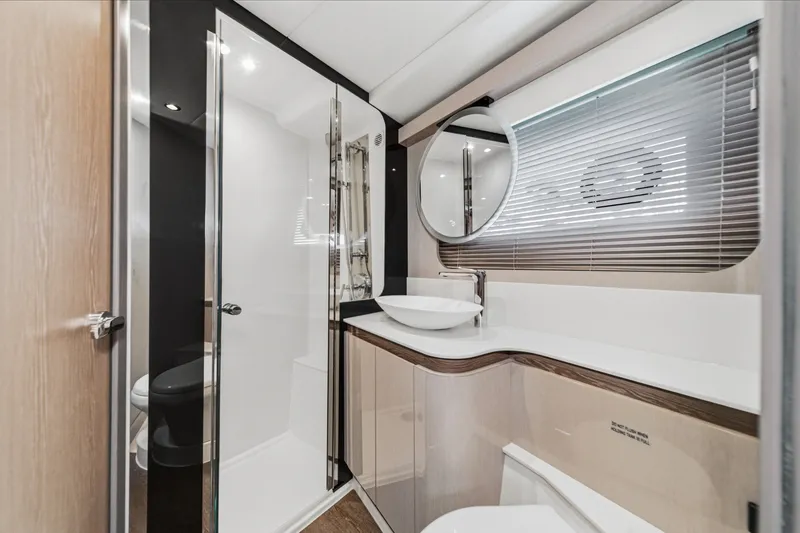 Slide: The Image of Luxurious bathroom interior of 2027 Cruisers Yachts 50 Fly with modern fixtures and elegant design. - 85