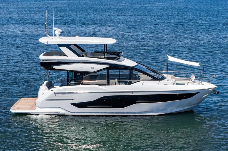 Slide: The Image of 2027 Cruisers Yachts 50 Fly luxury yacht cruising on open water. - 17