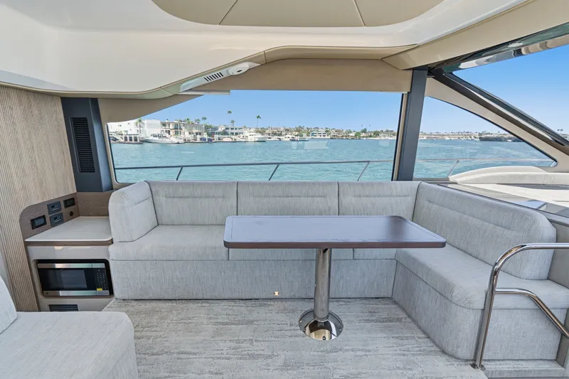 Slide: The Image of Luxurious interior of 2027 Cruisers Yachts 50 Fly with waterfront view. - 63