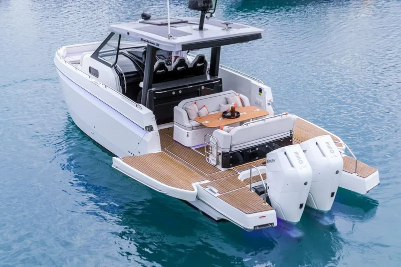The Image of 2026 Beneteau Gran Turismo 35 yacht with spacious deck and twin outboard engines. - 1
