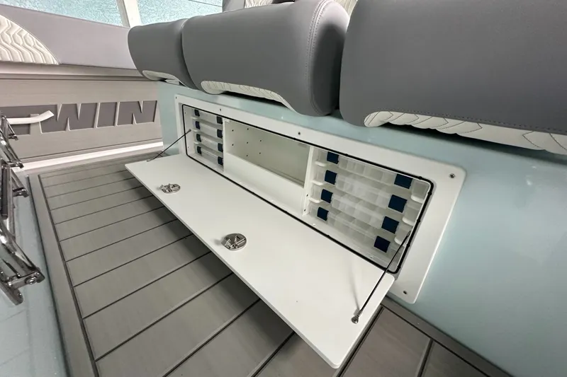 Slide: The Image of 2025 Twin Vee 400 GFX2 CC boat interior storage compartment with seating. - 24