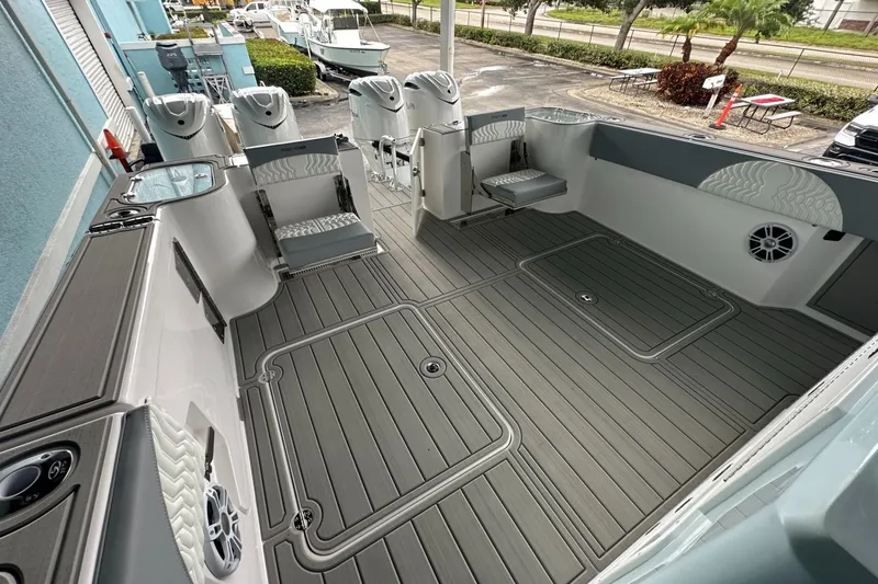 Slide: The Image of 2025 Twin Vee 400 GFX2 CC boat interior with spacious deck and modern seating. - 18
