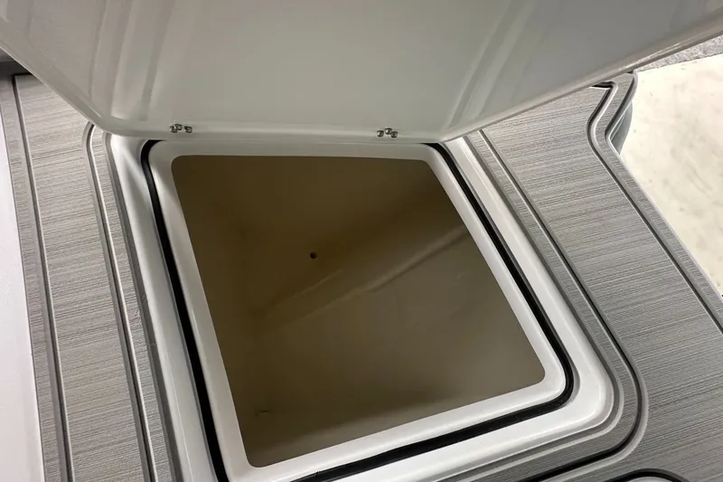 Slide: The Image of Open storage compartment on 2025 Twin Vee 400 GFX2 CC boat. - 34
