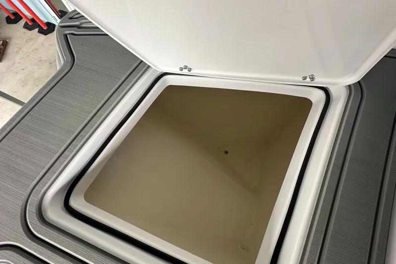 Slide: The Image of Open storage compartment on 2025 Twin Vee 400 GFX2 CC boat. - 33