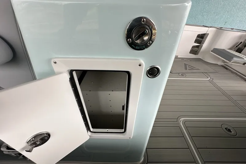 Slide: The Image of Open storage compartment on 2025 Twin Vee 400 GFX2 CC boat deck. - 23
