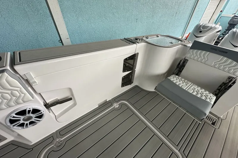 Slide: The Image of 2025 Twin Vee 400 GFX2 CC boat interior with seating and speaker detail. - 17