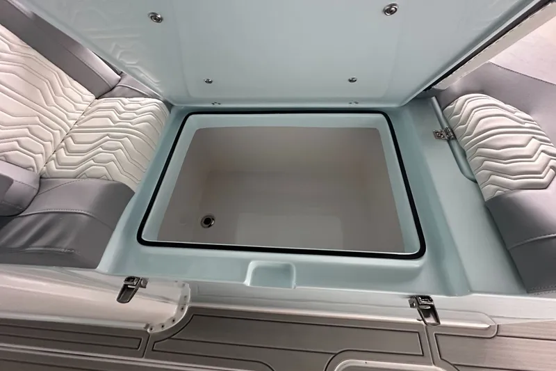 Slide: The Image of 2025 Twin Vee 400 GFX2 CC boat interior storage compartment with cushioned seating. - 39