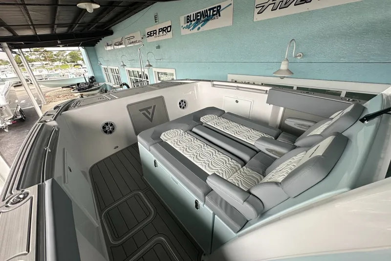 Slide: The Image of 2025 Twin Vee 400 GFX2 CC boat interior with cushioned seating and modern design. - 42