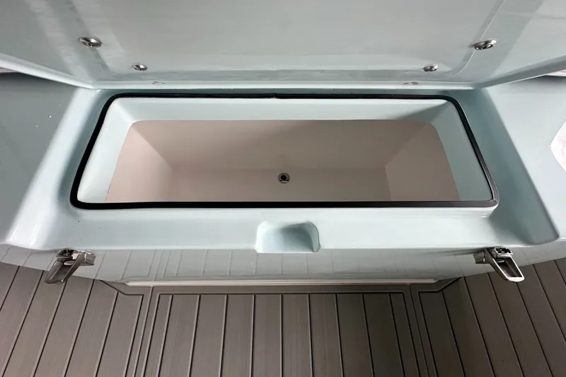 Slide: The Image of Open storage compartment on 2025 Twin Vee 400 GFX2 CC boat. - 38