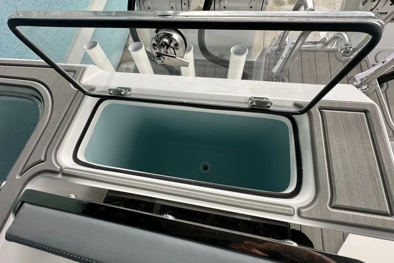 Slide: The Image of Open storage compartment on 2025 Twin Vee 400 GFX2 CC boat. - 12