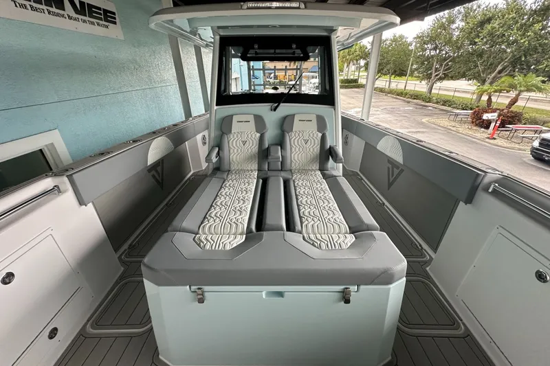 Slide: The Image of 2025 Twin Vee 400 GFX2 CC boat interior with modern seating and sleek design. - 41
