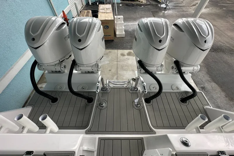 Slide: The Image of Four powerful outboard motors on a 2025 Twin Vee 400 GFX2 CC boat. - 7