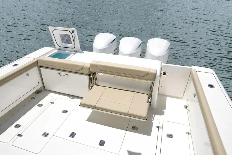 Slide: The Image of Manufacturer Provided Image: 2023 Pursuit OS 385 Offshore boat with foldable seating and triple outboard engines. - 4