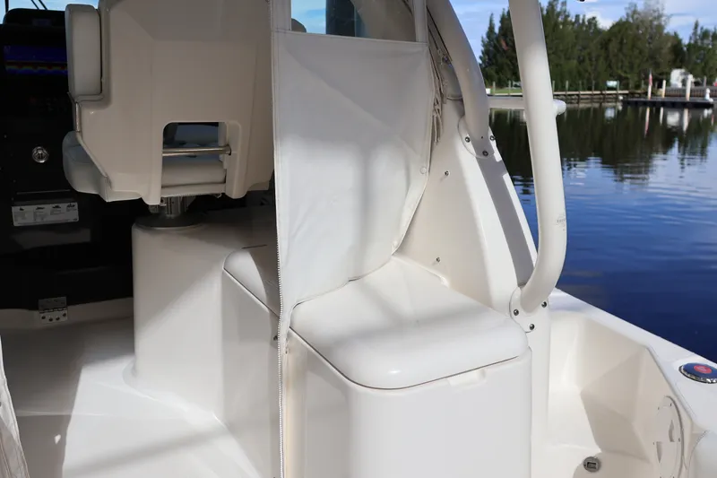 Slide: The Image of 2023 Pursuit OS 385 Offshore boat interior with seating and helm station. - 26