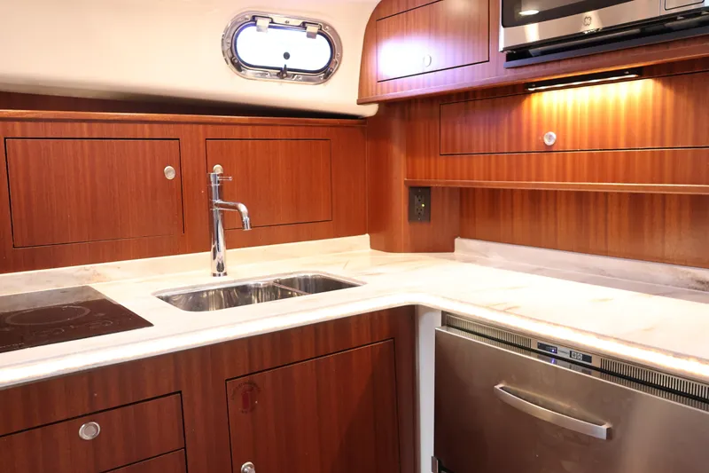 Slide: The Image of Luxurious kitchen interior of 2023 Pursuit OS 385 Offshore yacht with modern amenities. - 37