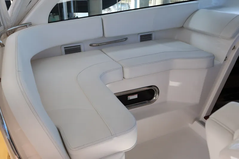 Slide: The Image of Luxurious white seating area on 2023 Pursuit OS 385 Offshore boat. - 31