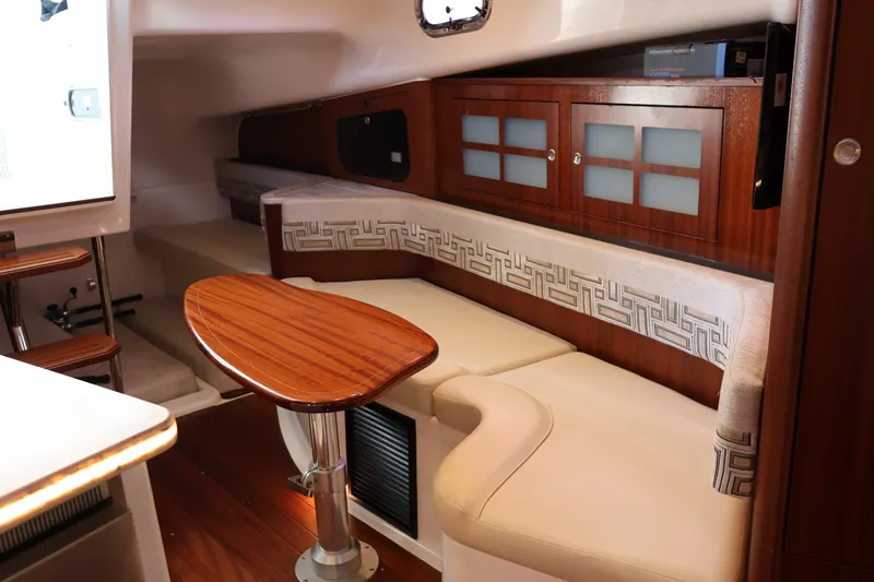 Slide: The Image of Luxurious interior of 2023 Pursuit OS 385 Offshore yacht with elegant seating and wooden cabinetry. - 46