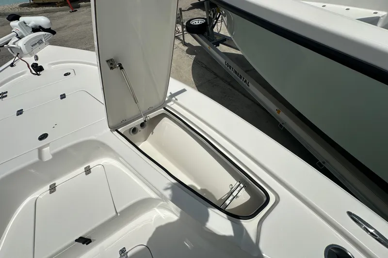 Slide: The Image of 2026 Sea Pro 230 Bay boat with open storage compartment on deck. - 10